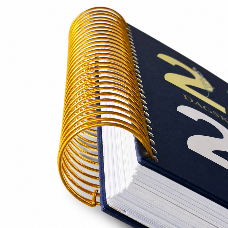 spiral notebooks (year) 03 gold spiral binding macro view spiral notebooks (year) 03 gold spiral binding macro view